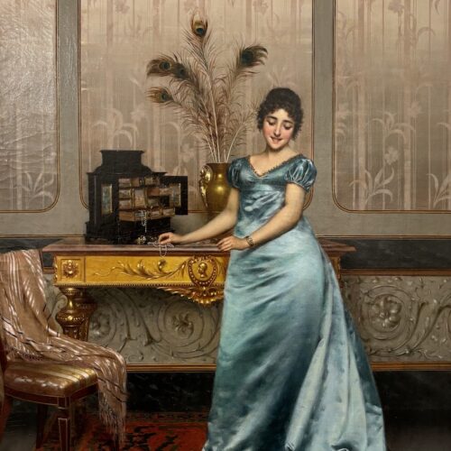 Bashful Model by Vittorio Reggianini depicts a pale women wearing a cyan blue dress that's drapping on the carpet below. The women stands infront of a gold desk and open jewellery box.